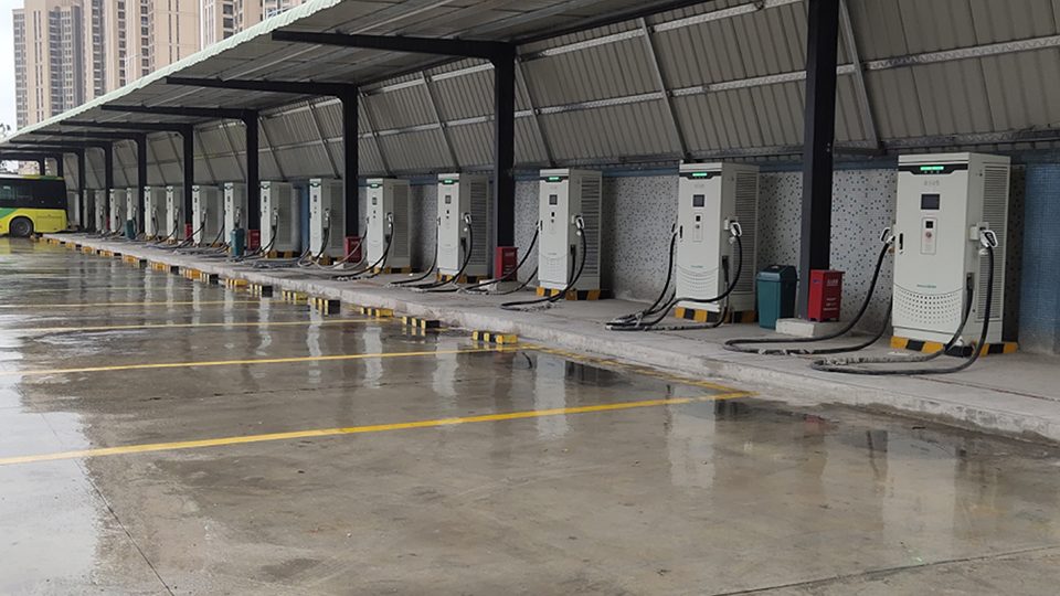Covered charging depot with a row of DC chargers