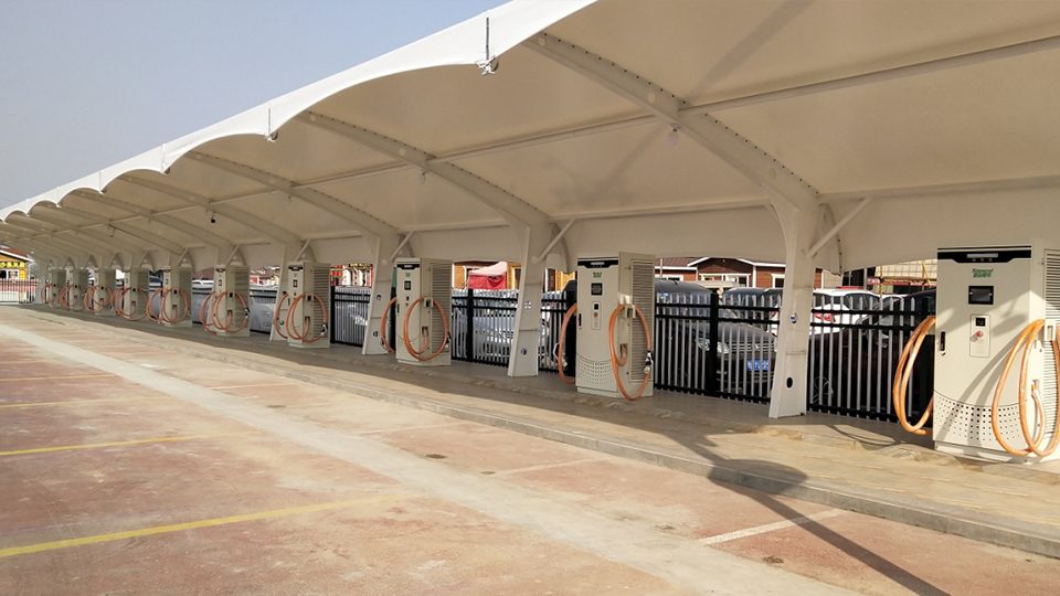 Canopied public transport charging station with cable management